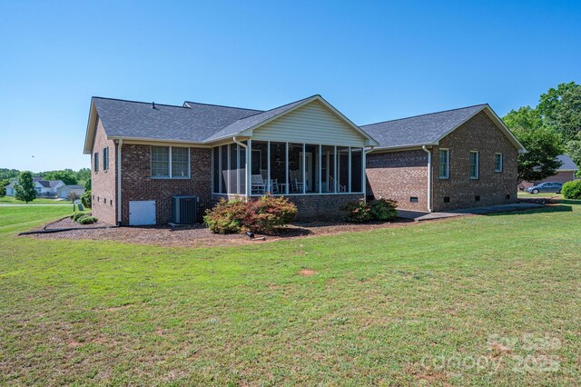 118 Sir Gregory Dr, Shelby, NC 28152 - back of property featuring brick siding, central AC unit, a yard, and a sunroom