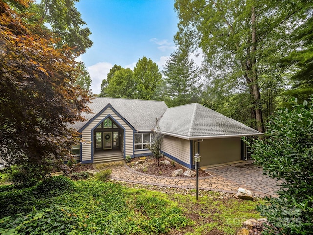 view of front of property featuring roof with shingles