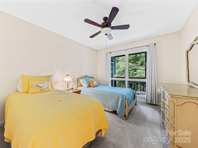 bedroom with a ceiling fan and light colored carpet
