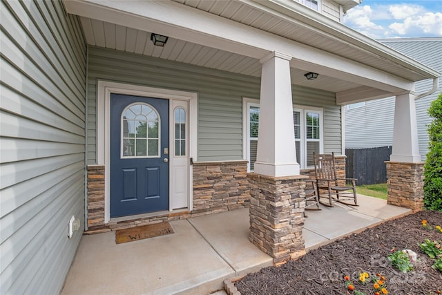 306 Fesperman Cir, Troutman, NC 28166 - entrance to property featuring stone siding and a porch