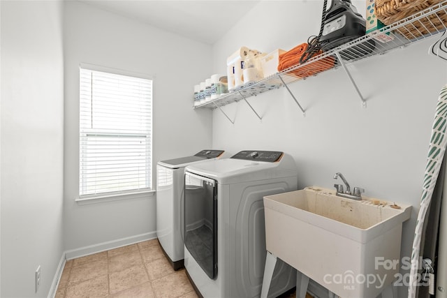 306 Fesperman Cir, Troutman, NC 28166 - laundry area featuring separate washer and dryer and baseboards
