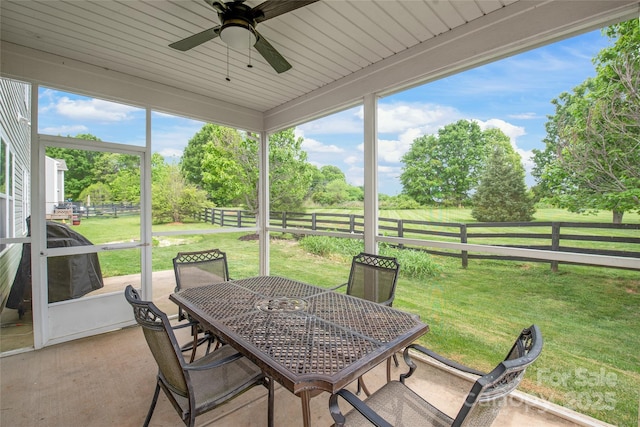 306 Fesperman Cir, Troutman, NC 28166 - sunroom / solarium featuring ceiling fan, outdoor dining space, and view of scattered trees