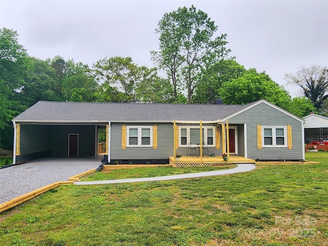 501 N Hawthorne St, Mount Holly, NC 28120 - ranch-style house featuring driveway, an attached carport, covered porch, a front yard, and crawl space