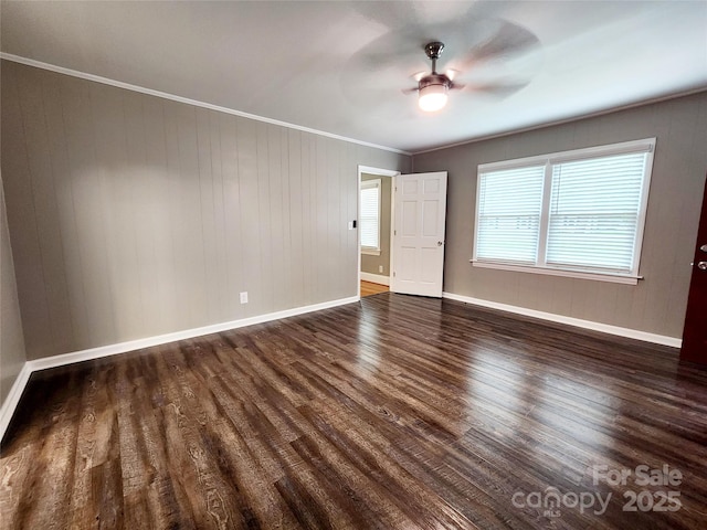 501 N Hawthorne St, Mount Holly, NC 28120 - empty room with ornamental molding, a ceiling fan, dark wood-style flooring, and baseboards