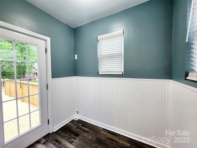 501 N Hawthorne St, Mount Holly, NC 28120 - doorway featuring dark wood-style flooring and a wainscoted wall