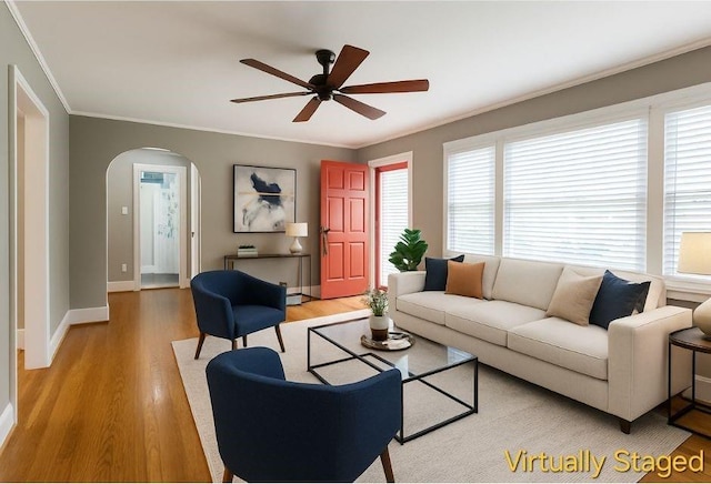 501 N Hawthorne St, Mount Holly, NC 28120 - living room with ornamental molding, arched walkways, a ceiling fan, and plenty of natural light