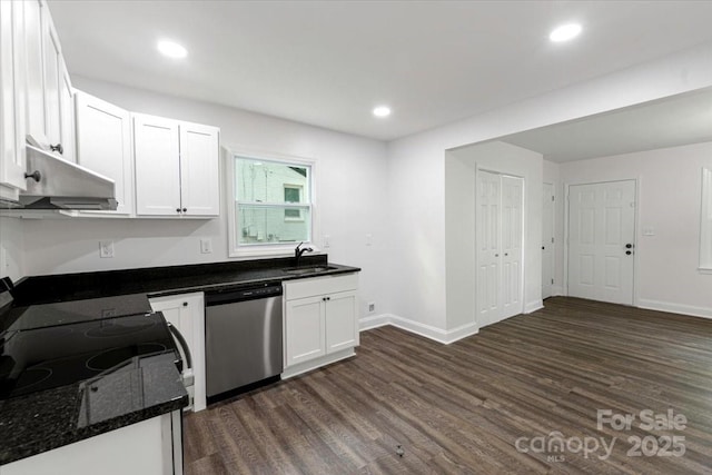 kitchen with stainless steel dishwasher, a sink, white cabinets, dark wood finished floors, and under cabinet range hood