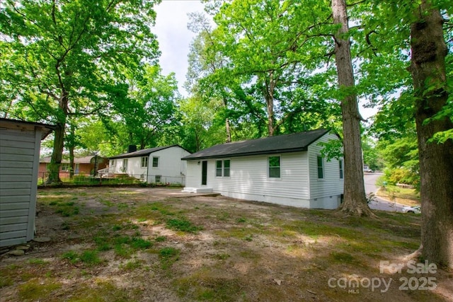 rear view of house with fence