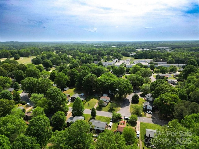 bird's eye view featuring a forest view