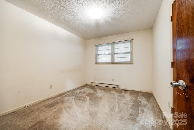 carpeted empty room with a baseboard radiator, visible vents, baseboards, and a textured ceiling