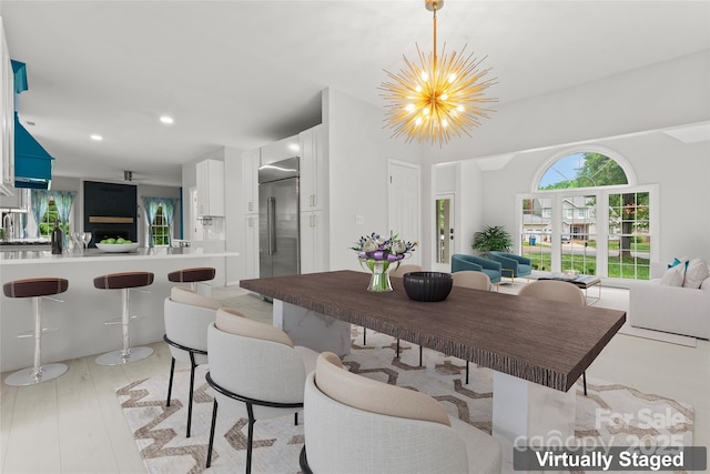 dining room with an inviting chandelier and recessed lighting