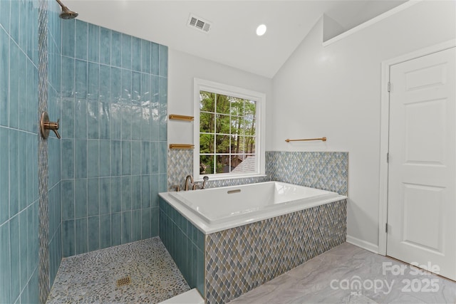 full bathroom featuring tiled shower, a tub, marble finish floor, vaulted ceiling, and visible vents