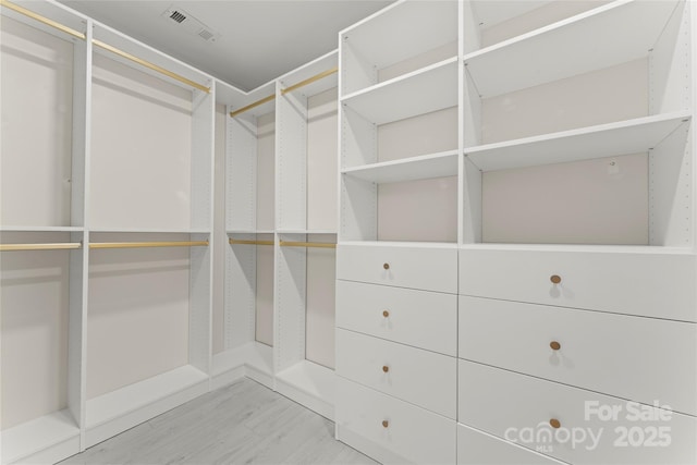 walk in closet with visible vents and light wood-style floors