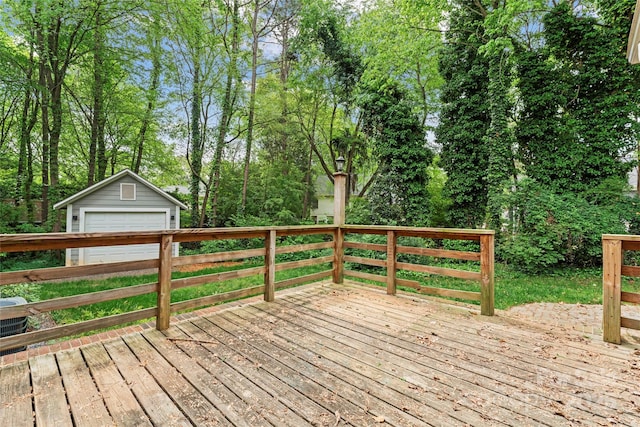 deck with an outdoor structure and a detached garage