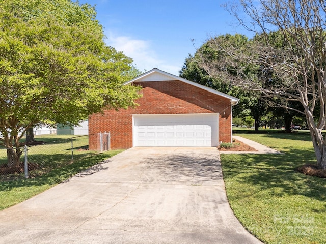 250 Log Barn Rd, Salisbury, NC 28146 - view of home's exterior featuring a lawn, fence, brick siding, an attached garage, and driveway