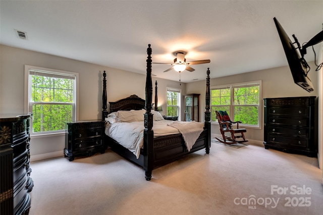 bedroom featuring baseboards, visible vents, ceiling fan, and carpet