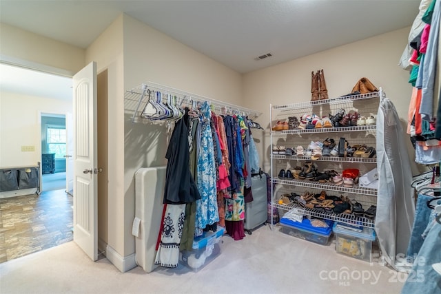 walk in closet with visible vents