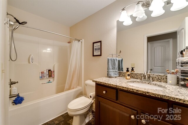 bathroom with vanity, toilet, shower / bath combination with curtain, stone finish floor, and visible vents