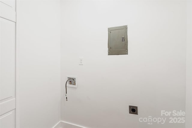laundry area with hookup for an electric dryer, electric panel, baseboards, and washer hookup