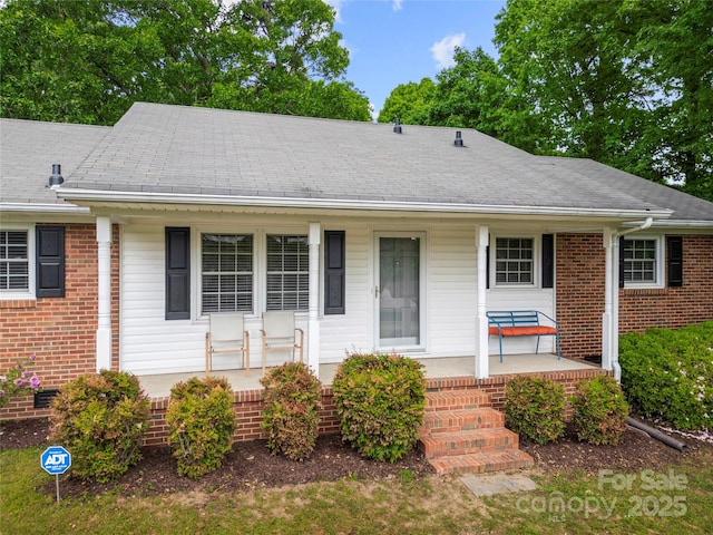 115 K M Murphy Rd, Gastonia, NC 28056 - view of front of house with covered porch and brick siding