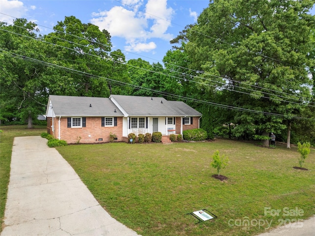 115 K M Murphy Rd, Gastonia, NC 28056 - single story home featuring brick siding, a front lawn, concrete driveway, and crawl space