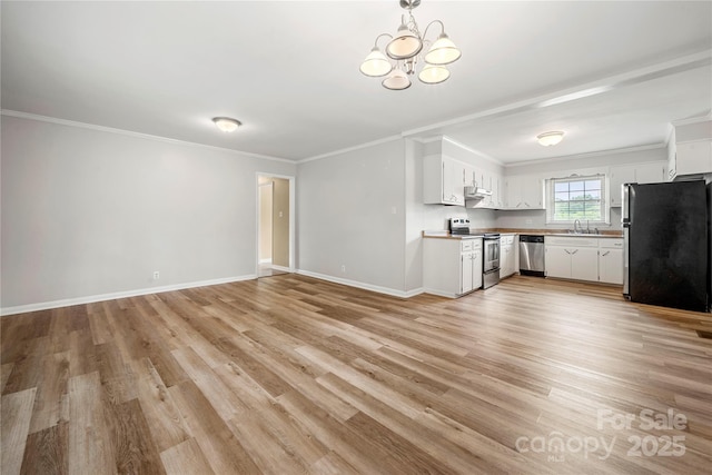115 K M Murphy Rd, Gastonia, NC 28056 - interior space with light wood-style flooring, white cabinets, appliances with stainless steel finishes, baseboards, and ornamental molding