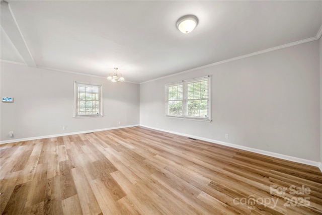 115 K M Murphy Rd, Gastonia, NC 28056 - unfurnished room with ornamental molding, a notable chandelier, light wood-style flooring, and baseboards