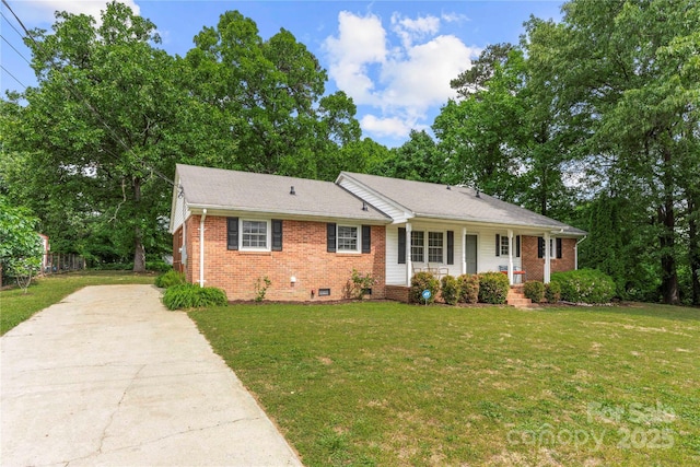 115 K M Murphy Rd, Gastonia, NC 28056 - ranch-style home featuring a front lawn, crawl space, covered porch, driveway, and brick siding