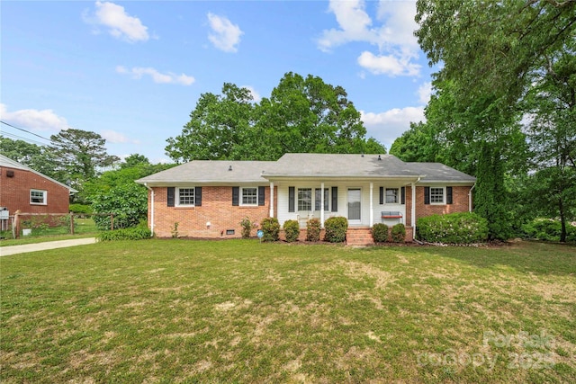 115 K M Murphy Rd, Gastonia, NC 28056 - single story home with a porch, brick siding, fence, crawl space, and a front lawn