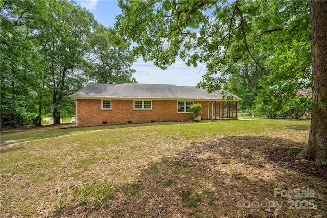 115 K M Murphy Rd, Gastonia, NC 28056 - rear view of property featuring a lawn, crawl space, brick siding, and a sunroom