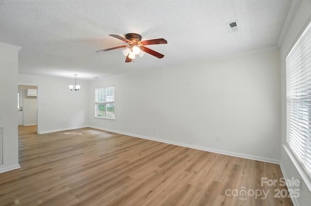 519 Jacobs Rdg, Fort Mill, SC 29715 - spare room featuring a ceiling fan, a chandelier, light wood finished floors, baseboards, and a textured ceiling
