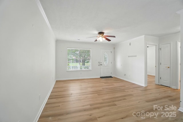519 Jacobs Rdg, Fort Mill, SC 29715 - unfurnished living room featuring ceiling fan, crown molding, light wood finished floors, and baseboards