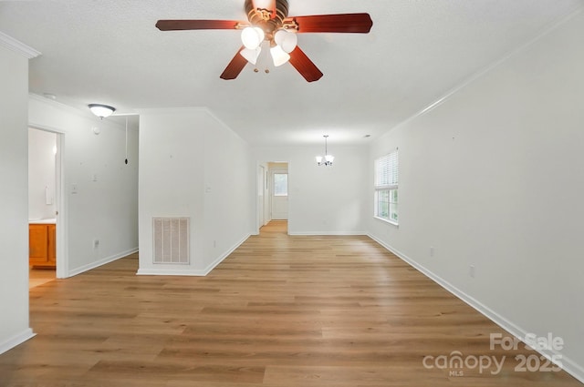 519 Jacobs Rdg, Fort Mill, SC 29715 - spare room with a chandelier, a ceiling fan, crown molding, light wood-type flooring, and baseboards