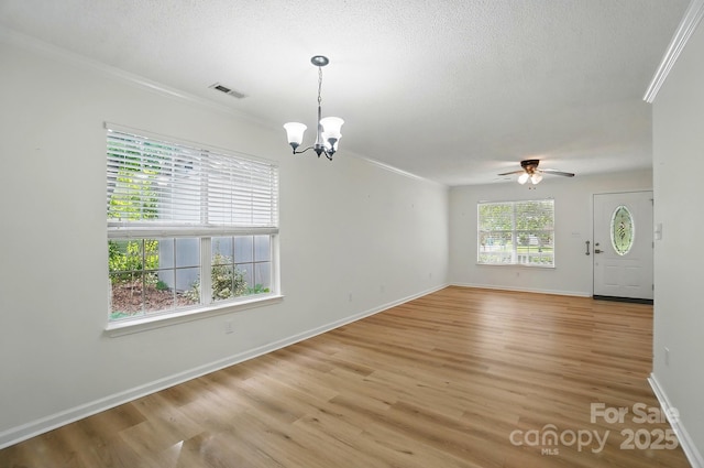 519 Jacobs Rdg, Fort Mill, SC 29715 - unfurnished dining area featuring crown molding, a chandelier, a ceiling fan, baseboards, and light wood-type flooring