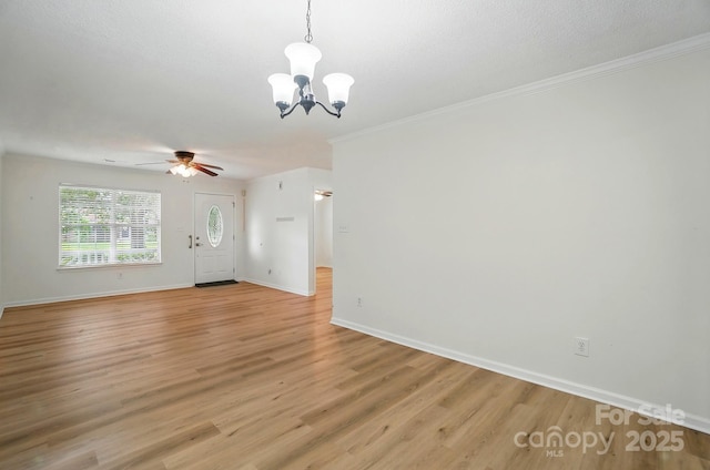 519 Jacobs Rdg, Fort Mill, SC 29715 - unfurnished living room with a chandelier, light wood-style floors, baseboards, a ceiling fan, and crown molding