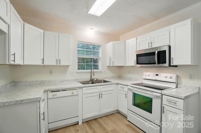 519 Jacobs Rdg, Fort Mill, SC 29715 - kitchen featuring white appliances, a sink, crown molding, a textured ceiling, and white cabinetry