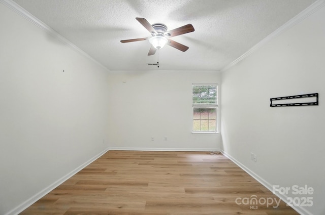 519 Jacobs Rdg, Fort Mill, SC 29715 - unfurnished room featuring a ceiling fan, ornamental molding, light wood finished floors, a textured ceiling, and baseboards