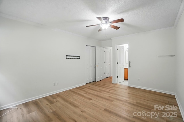 519 Jacobs Rdg, Fort Mill, SC 29715 - unfurnished bedroom featuring light wood-style flooring, baseboards, ornamental molding, ensuite bath, and ceiling fan