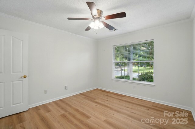 519 Jacobs Rdg, Fort Mill, SC 29715 - unfurnished room featuring light wood-style flooring, crown molding, ceiling fan, baseboards, and a textured ceiling