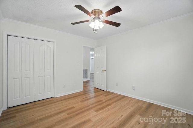 519 Jacobs Rdg, Fort Mill, SC 29715 - unfurnished bedroom featuring light wood-type flooring, crown molding, baseboards, a closet, and ceiling fan