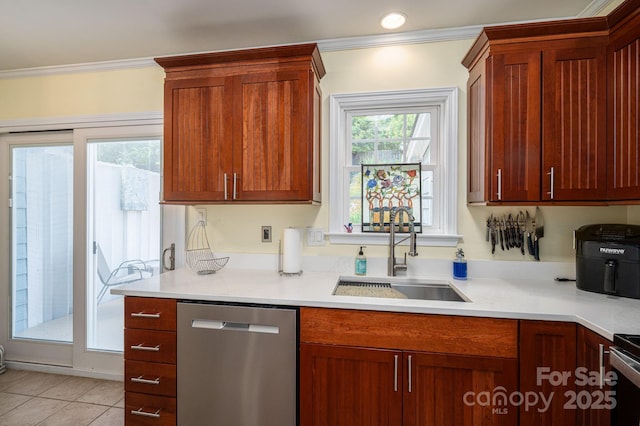 kitchen with a sink, light tile patterned floors, light countertops, ornamental molding, and stainless steel appliances
