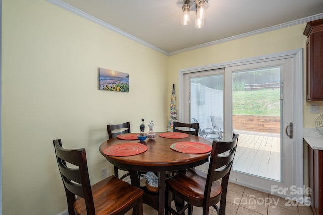 dining area featuring crown molding and light tile patterned flooring