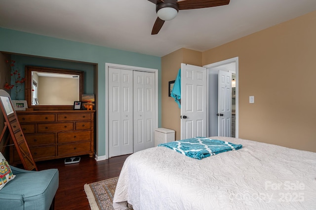 bedroom featuring dark wood-type flooring, baseboards, ceiling fan, and a closet