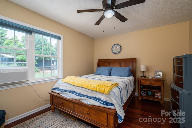 bedroom featuring baseboards, a ceiling fan, and wood finished floors