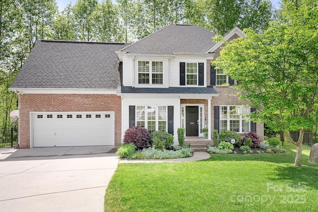 traditional-style home with brick siding, driveway, a shingled roof, and a front yard
