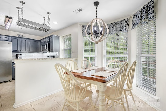 dining room with recessed lighting, a notable chandelier, visible vents, and light tile patterned floors