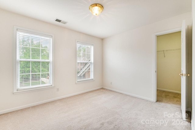 2620 Shady Reach Ln, Charlotte, NC 28214 - unfurnished bedroom featuring visible vents, baseboards, and light carpet