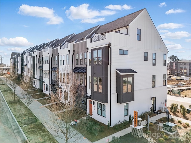 6009 Countess Dr Unit 50, Charlotte, NC 28217 - view of property exterior featuring board and batten siding and a residential view