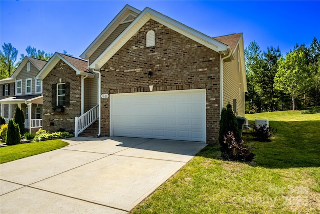 view of front facade featuring a garage, brick siding, a front yard, and concrete driveway