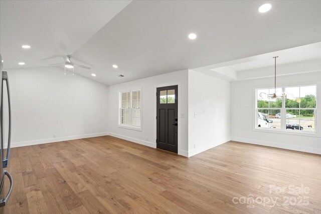 2429/2425 Ellen Ave, Charlotte, NC 28208 - unfurnished room with plenty of natural light, light wood-style flooring, and ceiling fan with notable chandelier
